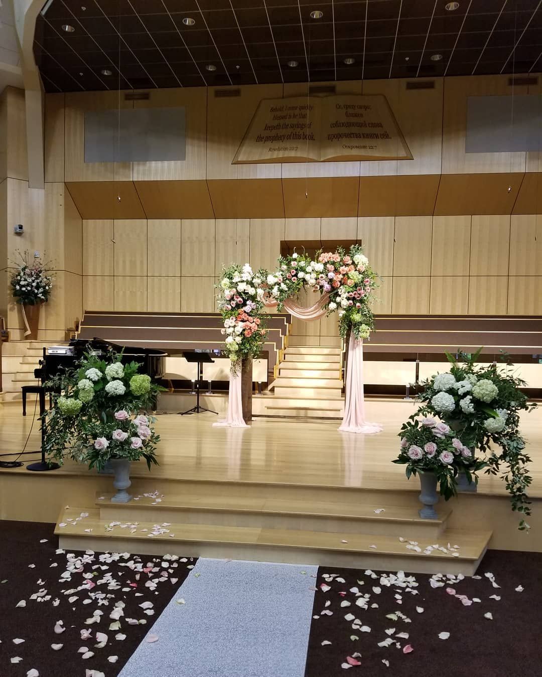 A church with flowers and petals on the floor