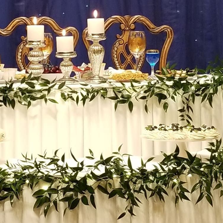 A table with candles and leaves on it