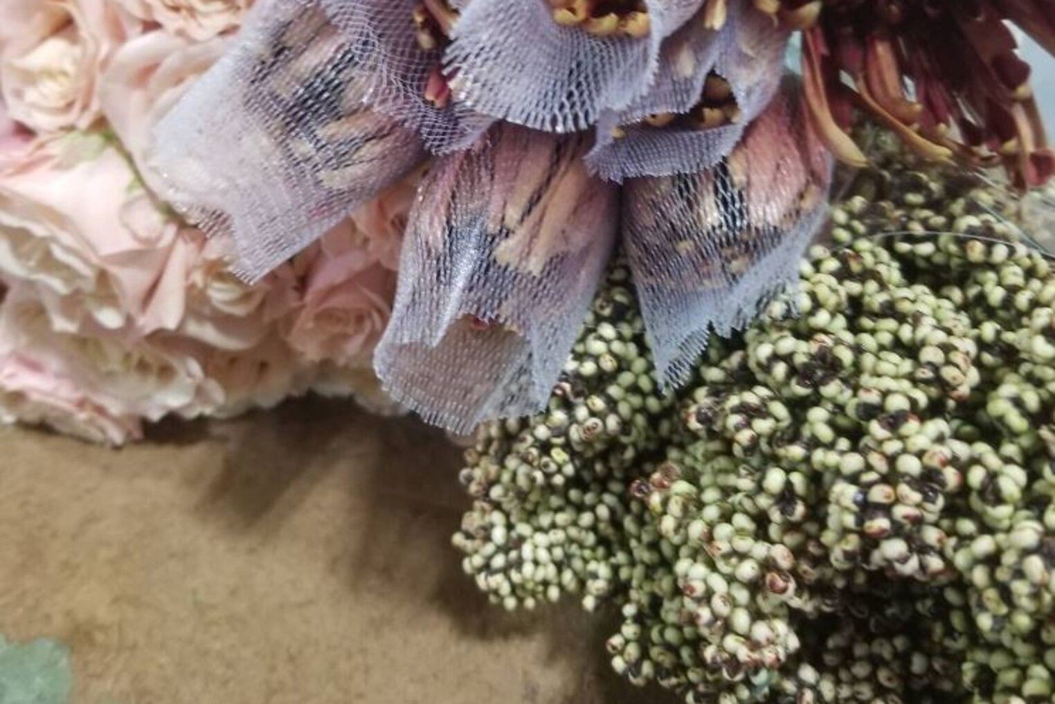 A bunch of flowers are sitting on a table.