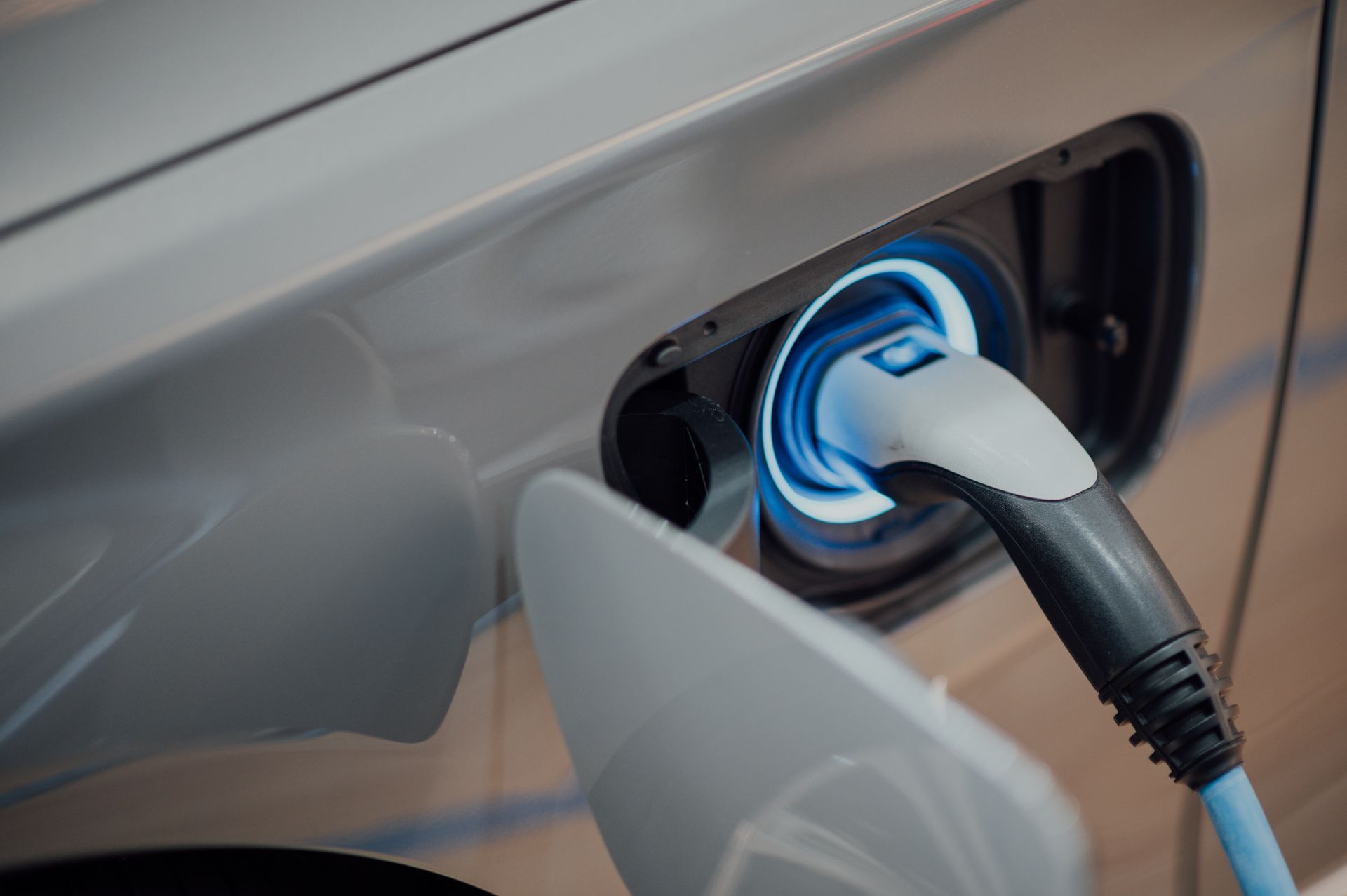 an electric car is plugged into a charging station