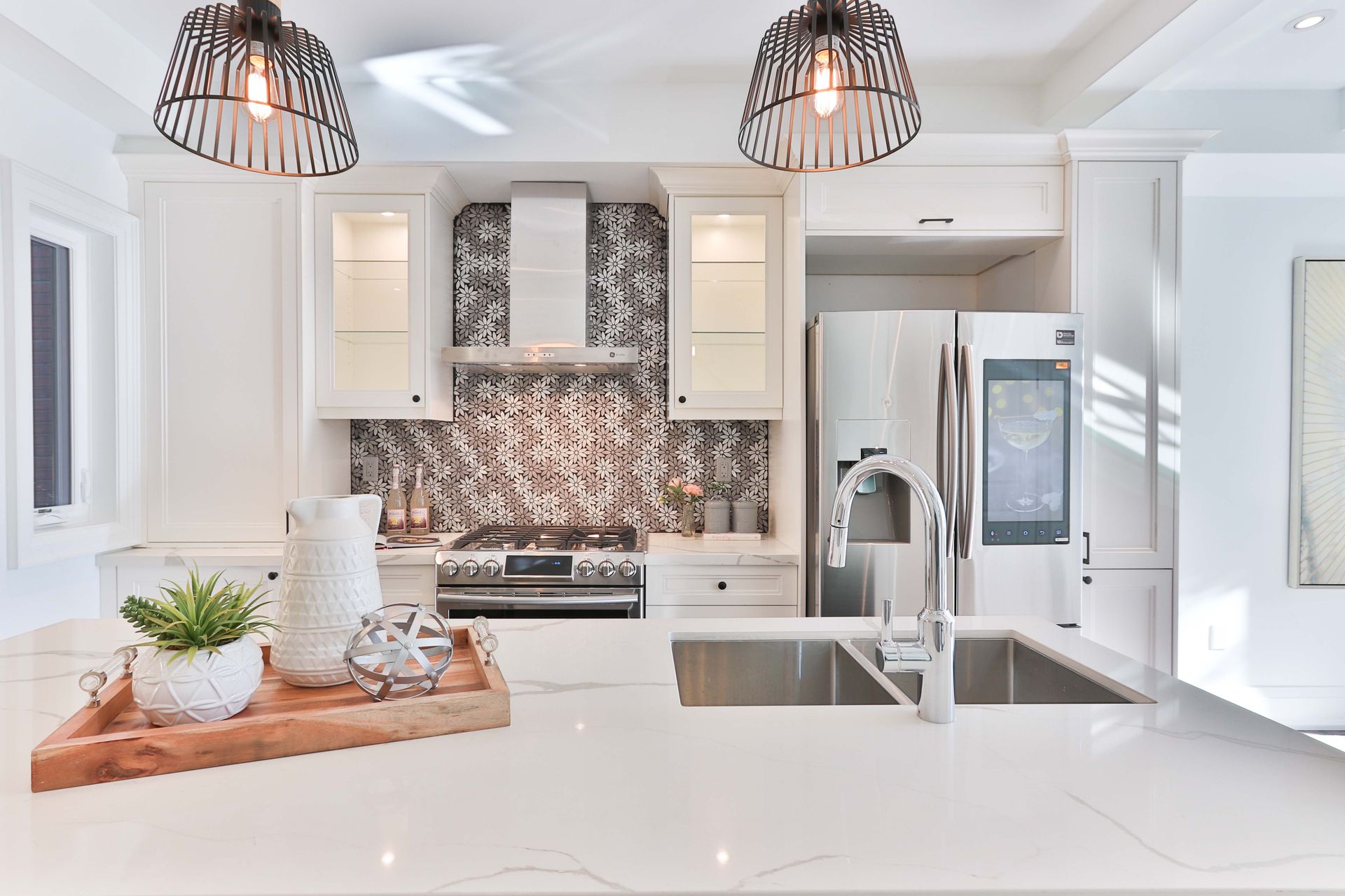 Modern kitchen with stylish pendant ceiling lights illuminating the island.
