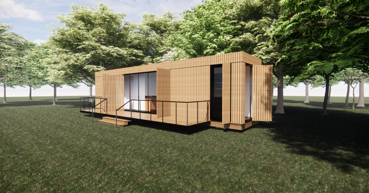 A wooden house is sitting on top of a lush green field surrounded by trees.