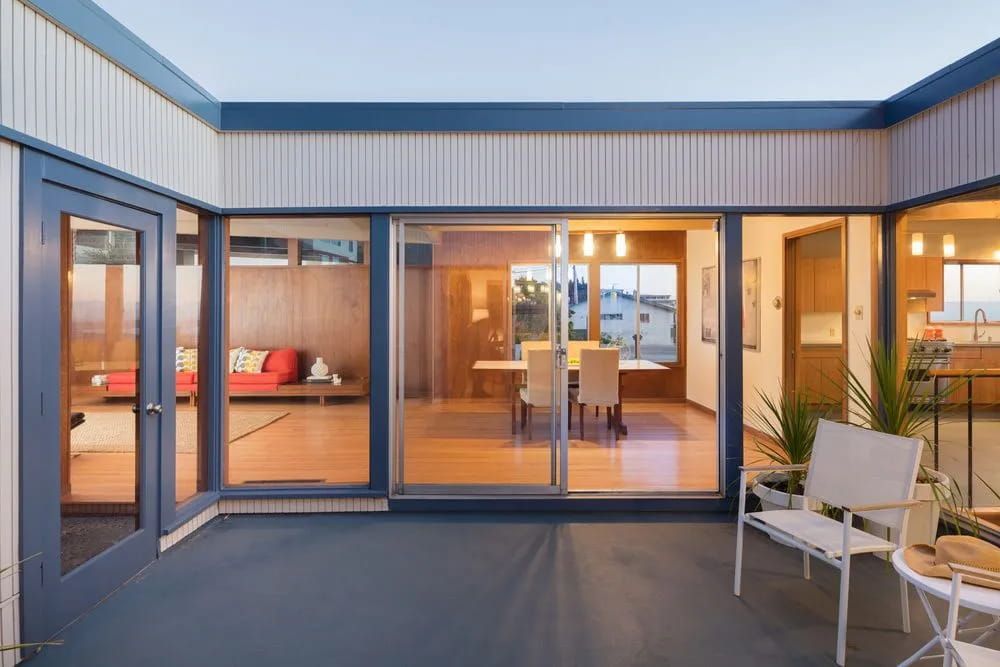 A Room with A Lot of Glass Doors and A Bench — Southside Aluminium Windows and Doors in Yallah, NSW