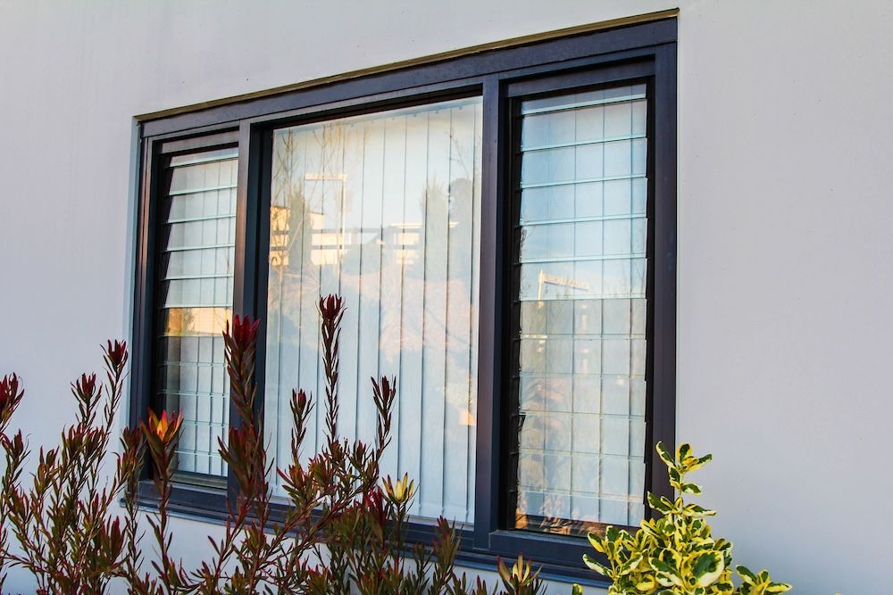 A Stack of Clear Glass Pieces Stacked on Top of Each Other — Southside Aluminium Windows and Doors in Yallah, NSW