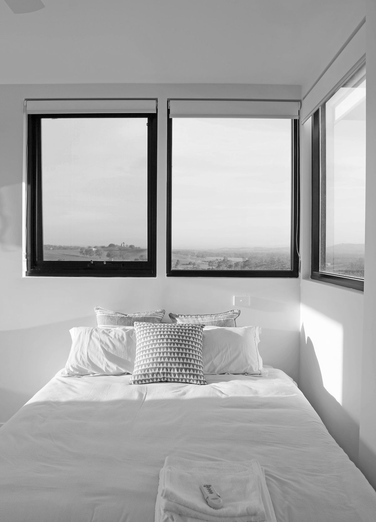 A House with A Dining Table and Chairs in The Backyard — Southside Aluminium Windows and Doors in Yallah, NSW