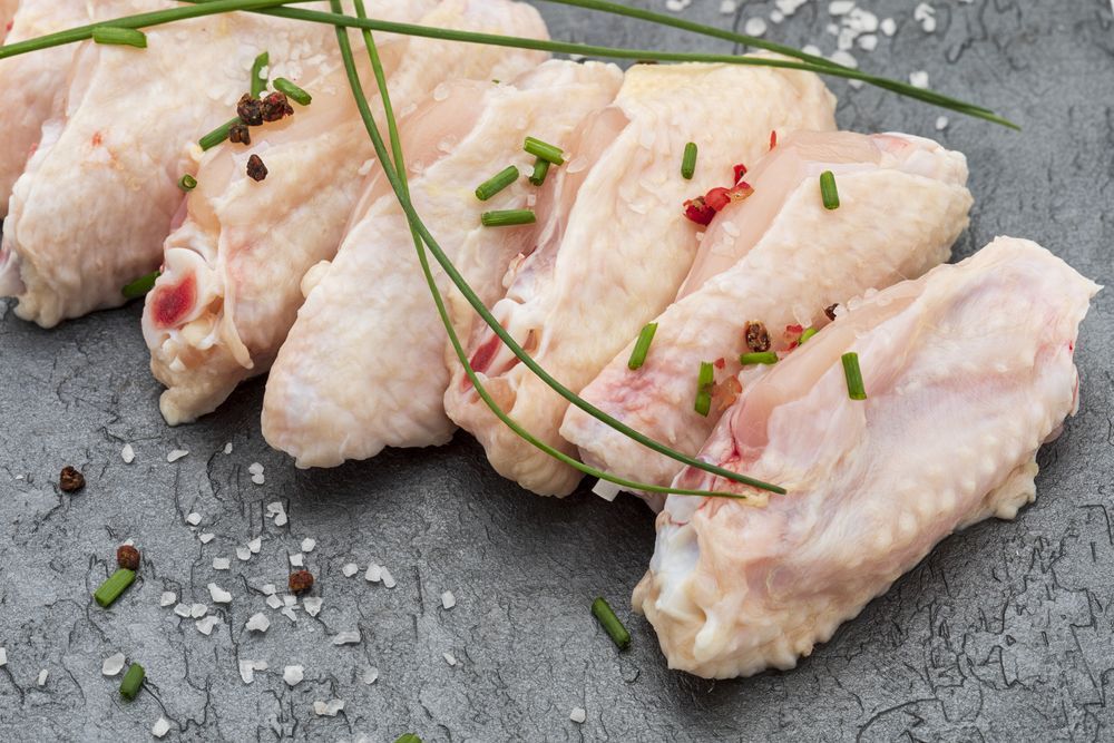 Raw Chicken Wings With Chives , Pepper And Salt On A Plate — McGrath Meats In Taree, NSW