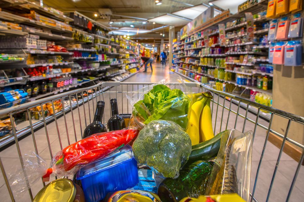 A Shopping Cart Filled With Fruits And Vegetables In A Supermarket — McGrath Meats In Taree, NSW