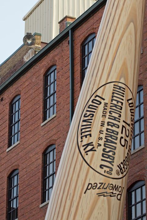 Louisville, United States -June 9, 2012: Close up of the giant bat in front of the Louisville Slugger Museum & Factory in Downtown Louisville, Kentucky. The Louisville Slugger Museum & Factory also serves as the Headquarters for the Louisville Slugger company. The landmark free standing bat weighs in at 68,000 pounds.