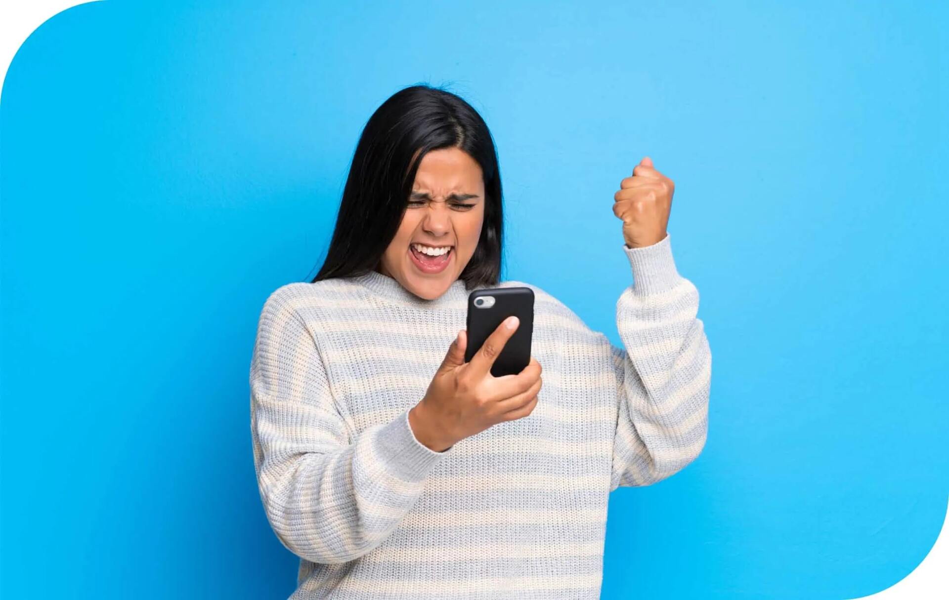 Excited woman holding a phone