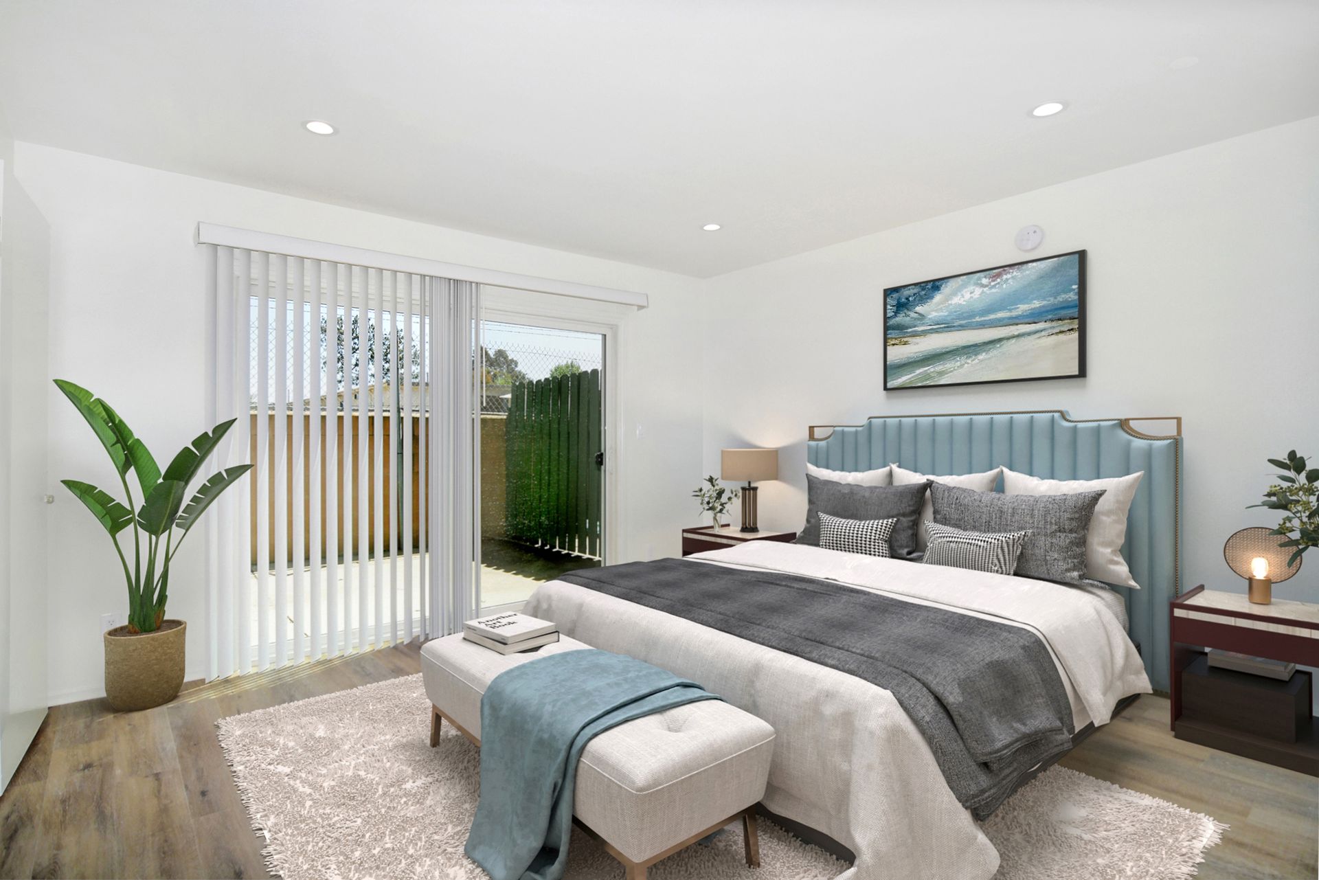 a bedroom with a large bed and a sliding glass door .