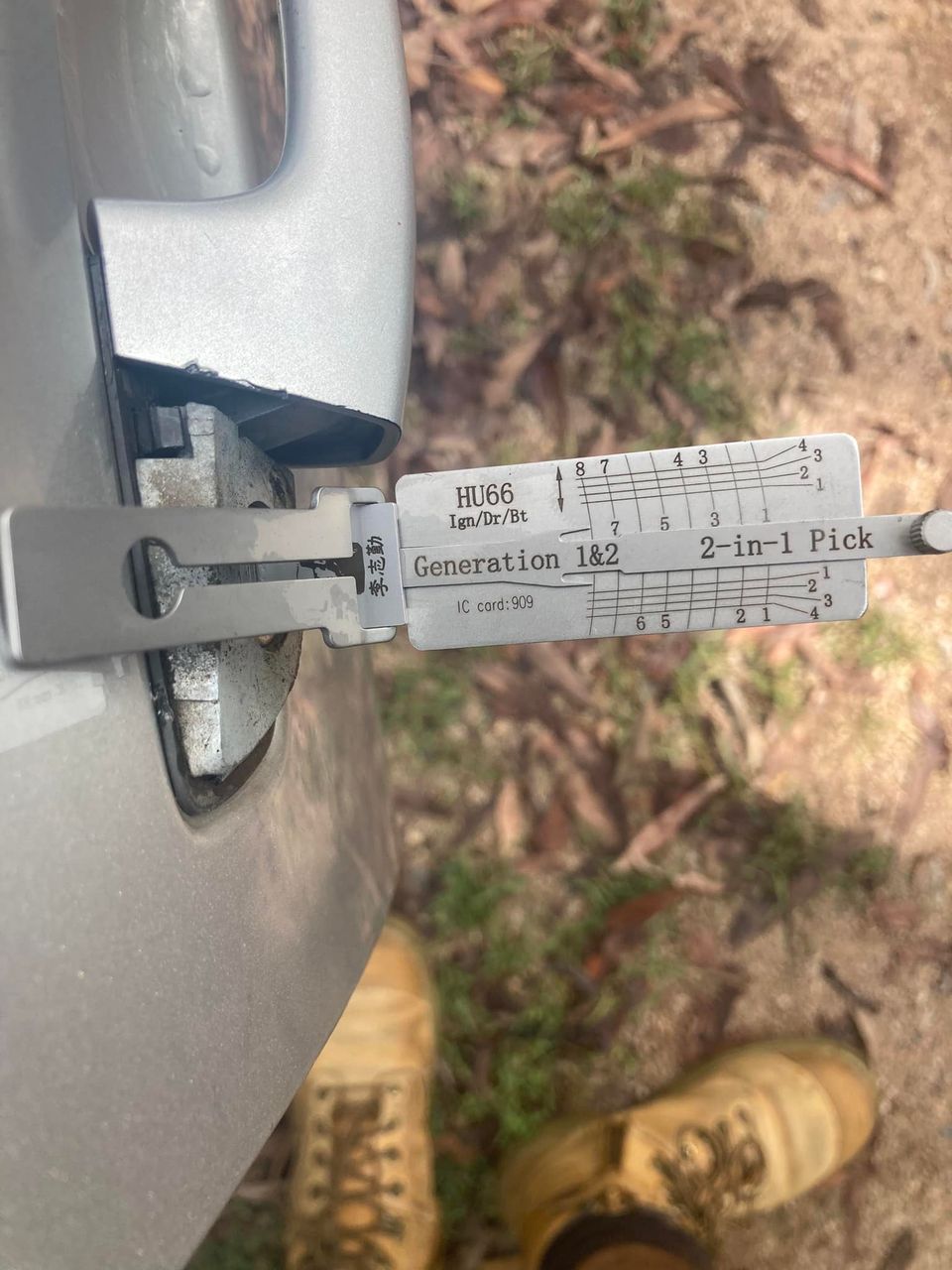 A car door lock being picked open with a 2-in-1 lock pick tool.— Locksmiths In Thuringowa Central, QLD