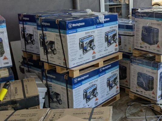 A Bunch of Boxes Are Stacked on Top of Each Other on Pallets — FarmCare in Mullumbimby, NSW