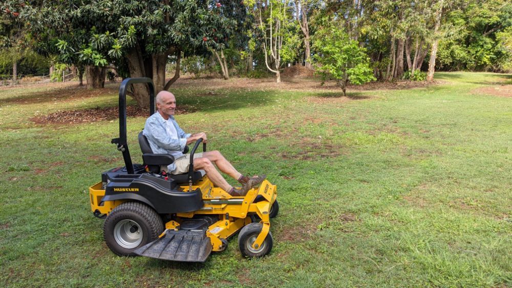 Man on Ride-on Mower — Farm Equipment Experts In Byron Bay, NSW
