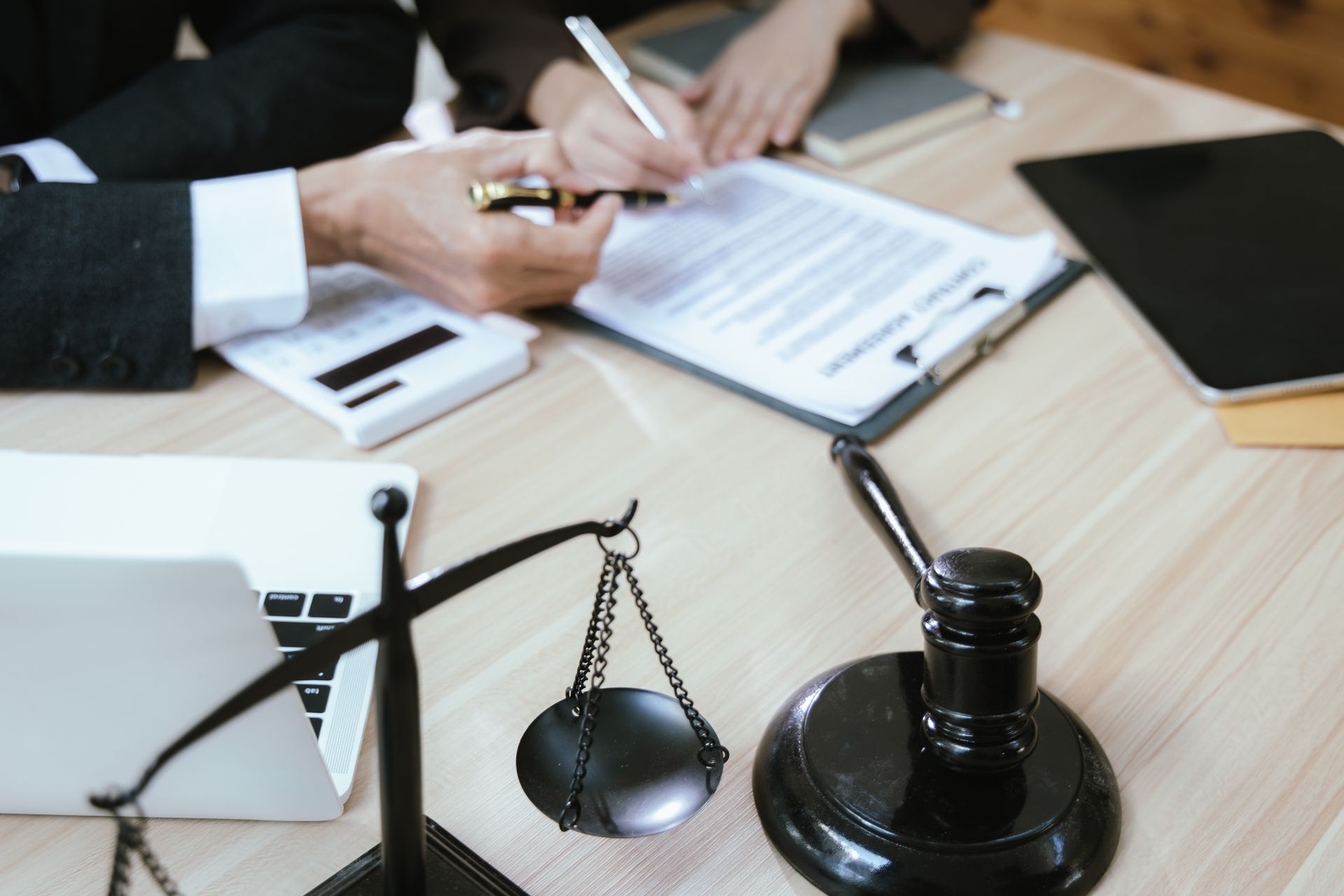Scales of justice and gavel on desk