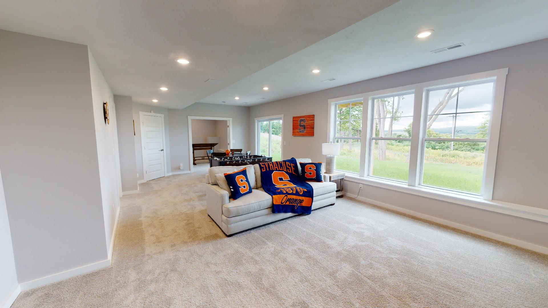 flex room with couch and table football