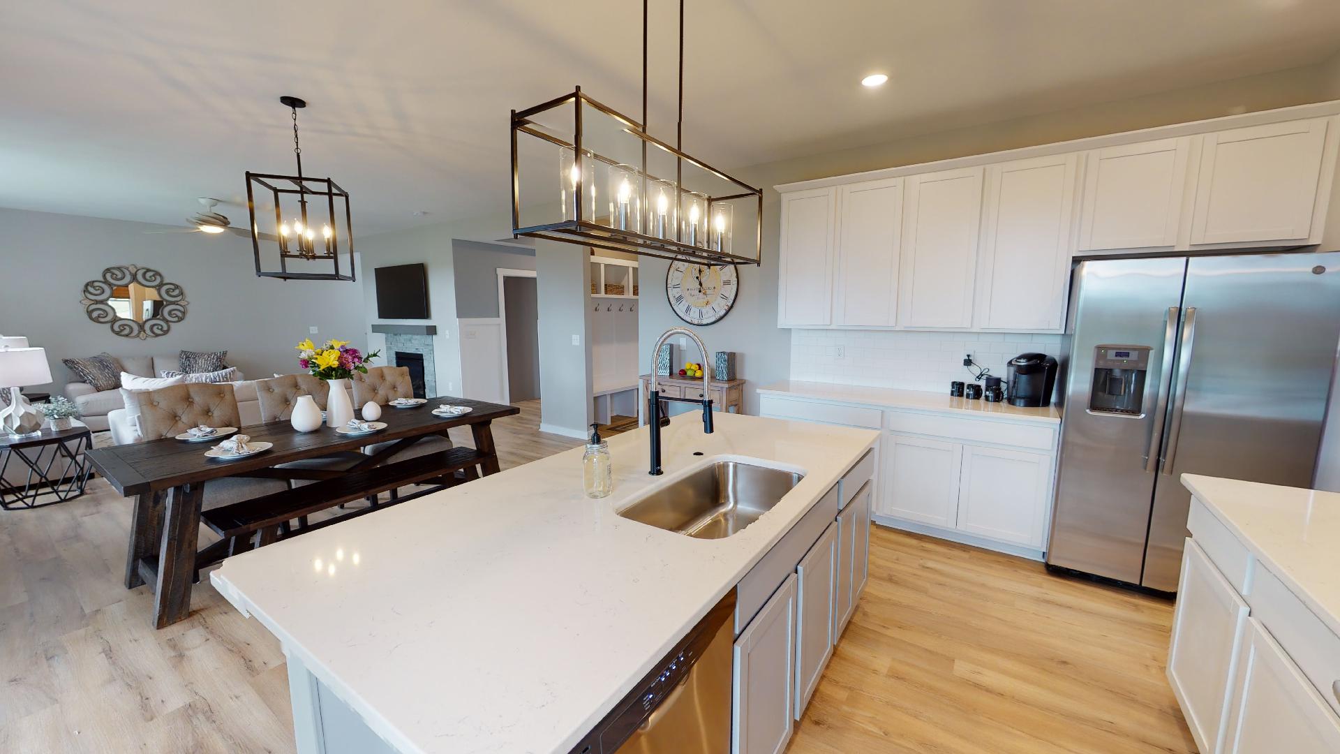 rectangular lighting over island with sink