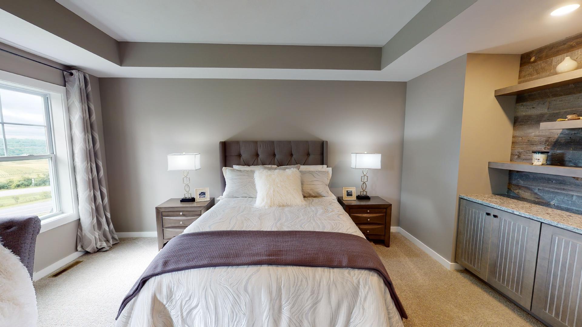 bedroom with recessed ceiling