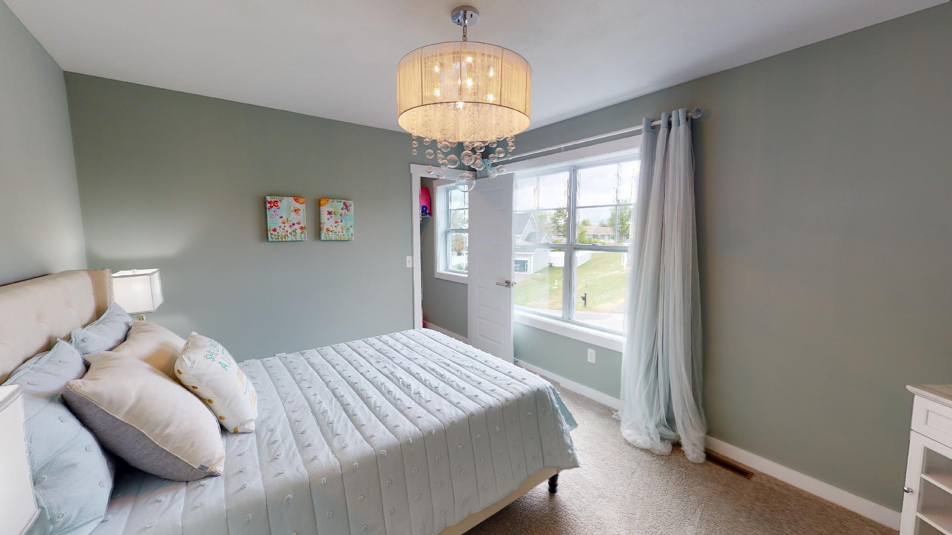 bedroom with bubble light fixture