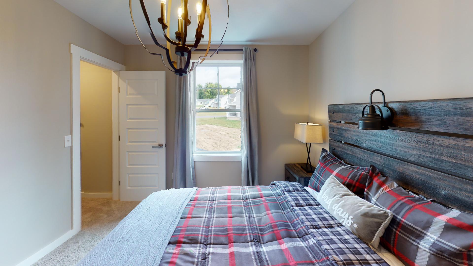 bedroom with rustic metal lighting