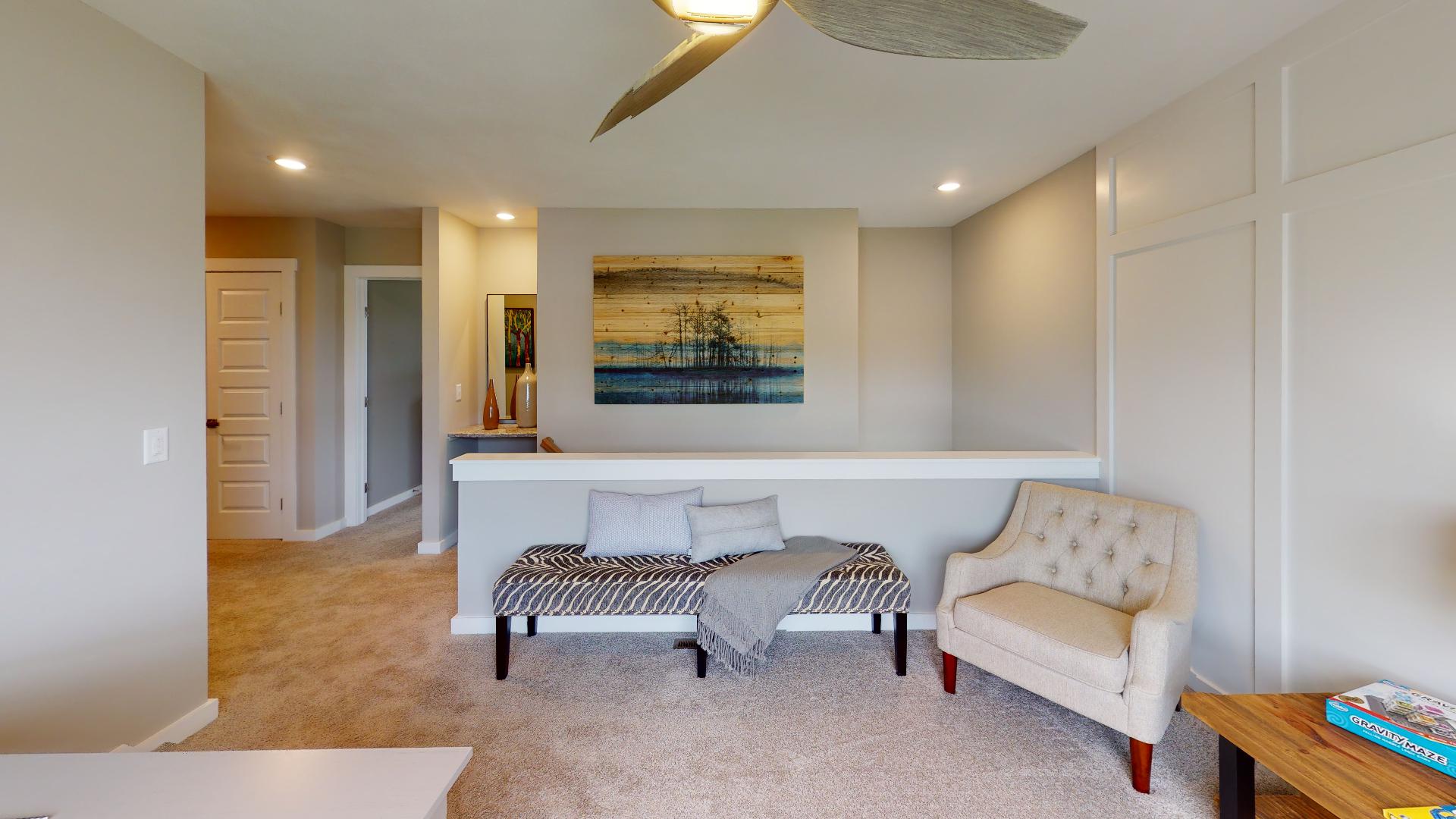 flex space with pony wall and ceiling fan