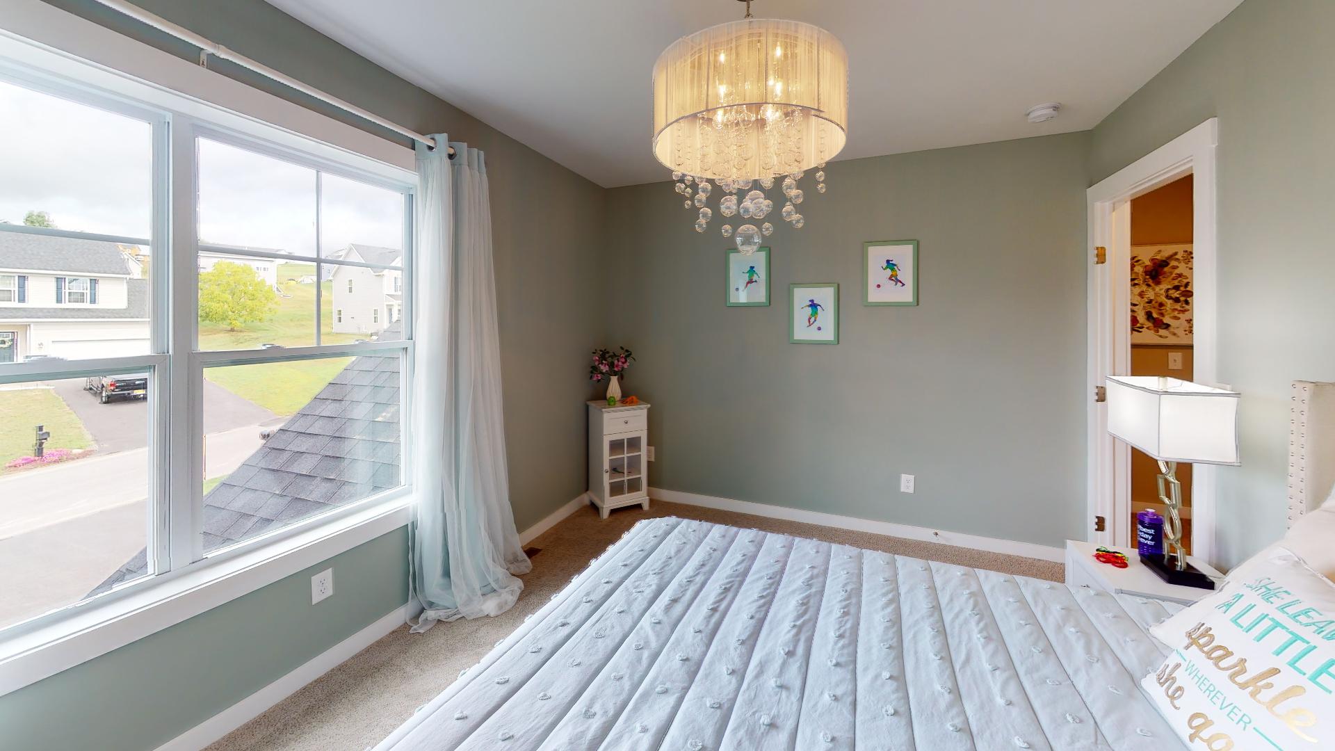 bedroom with bubble light fixture