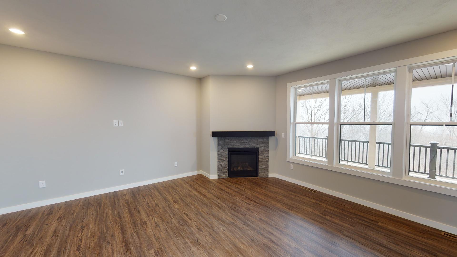 stairs and living room with fireplace