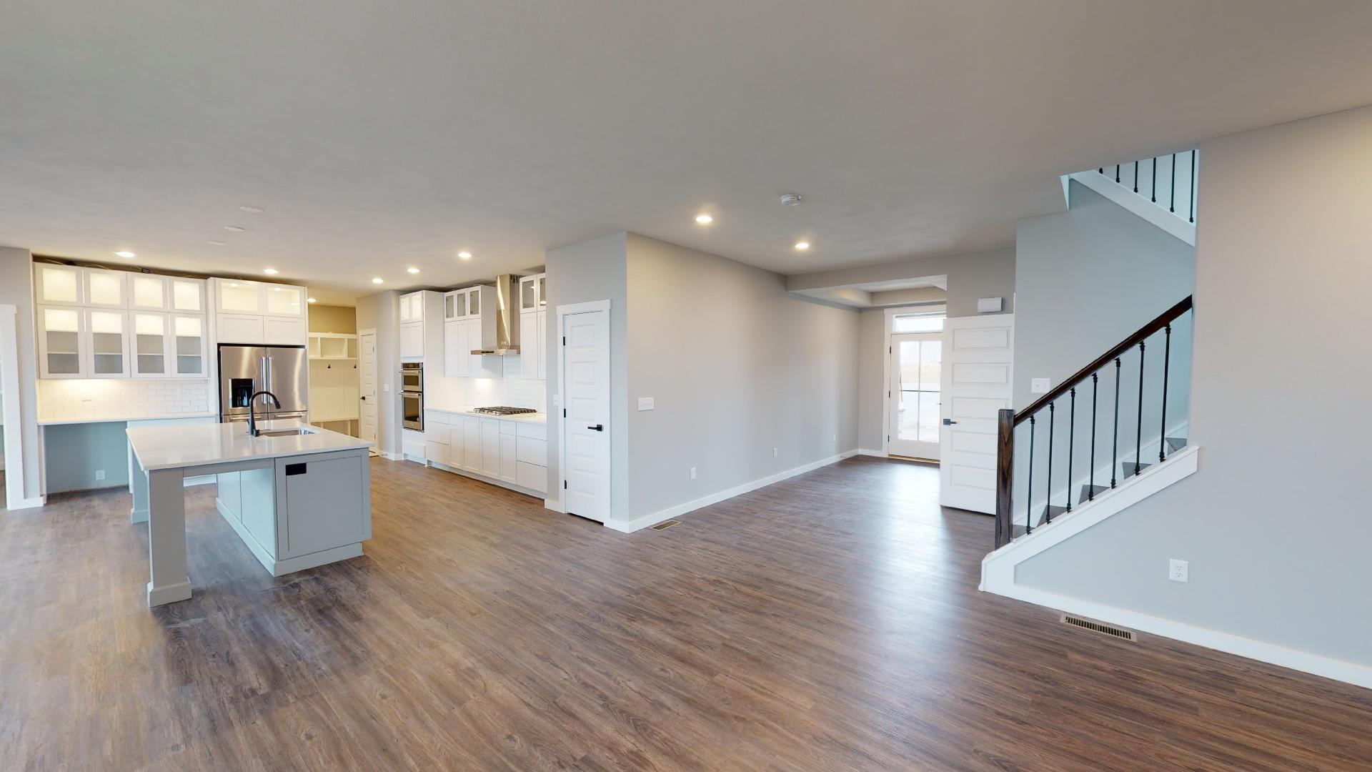 living room, stairs, kitchen, and front entryway