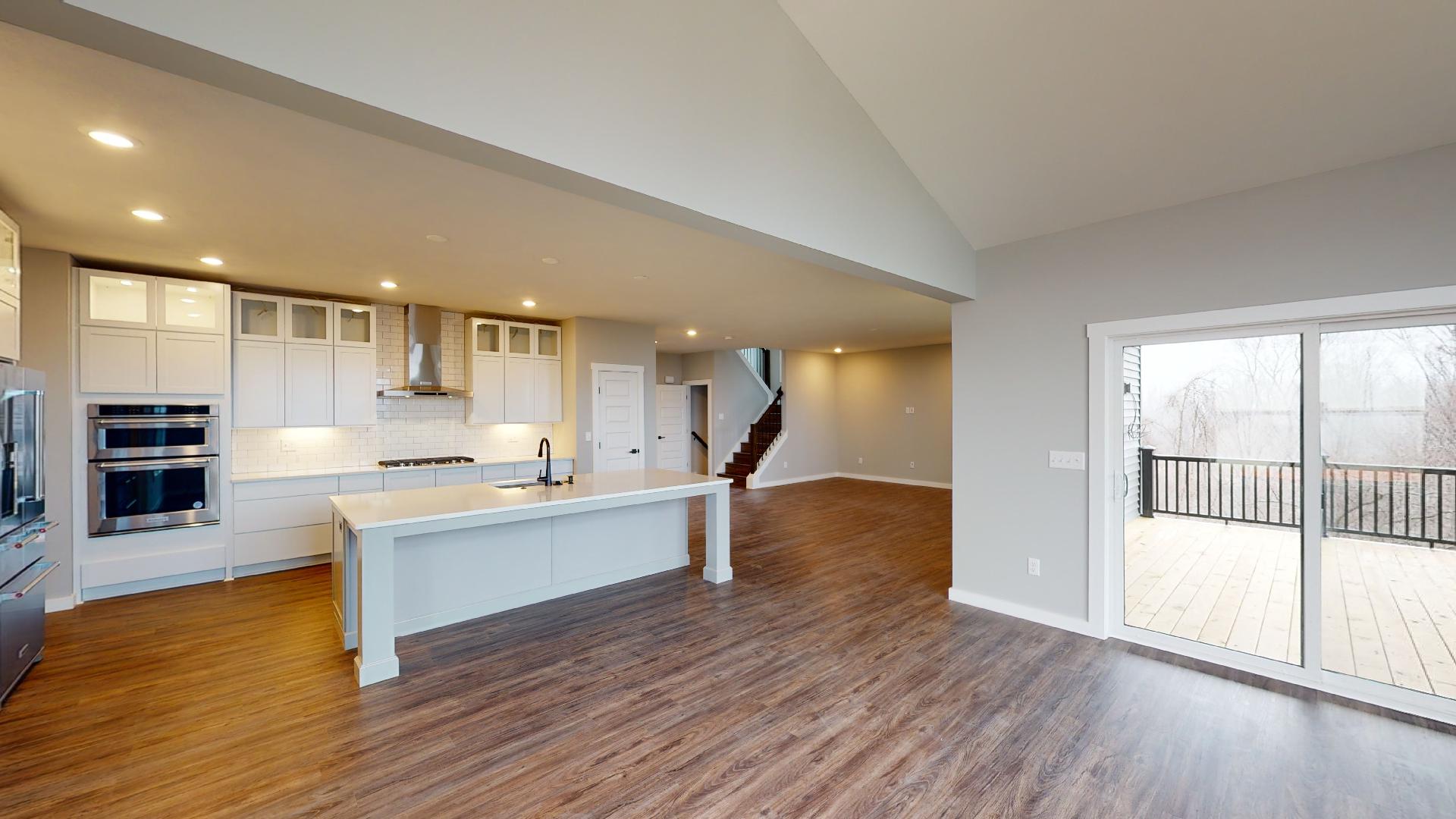 dining room with door to deck and kitchen