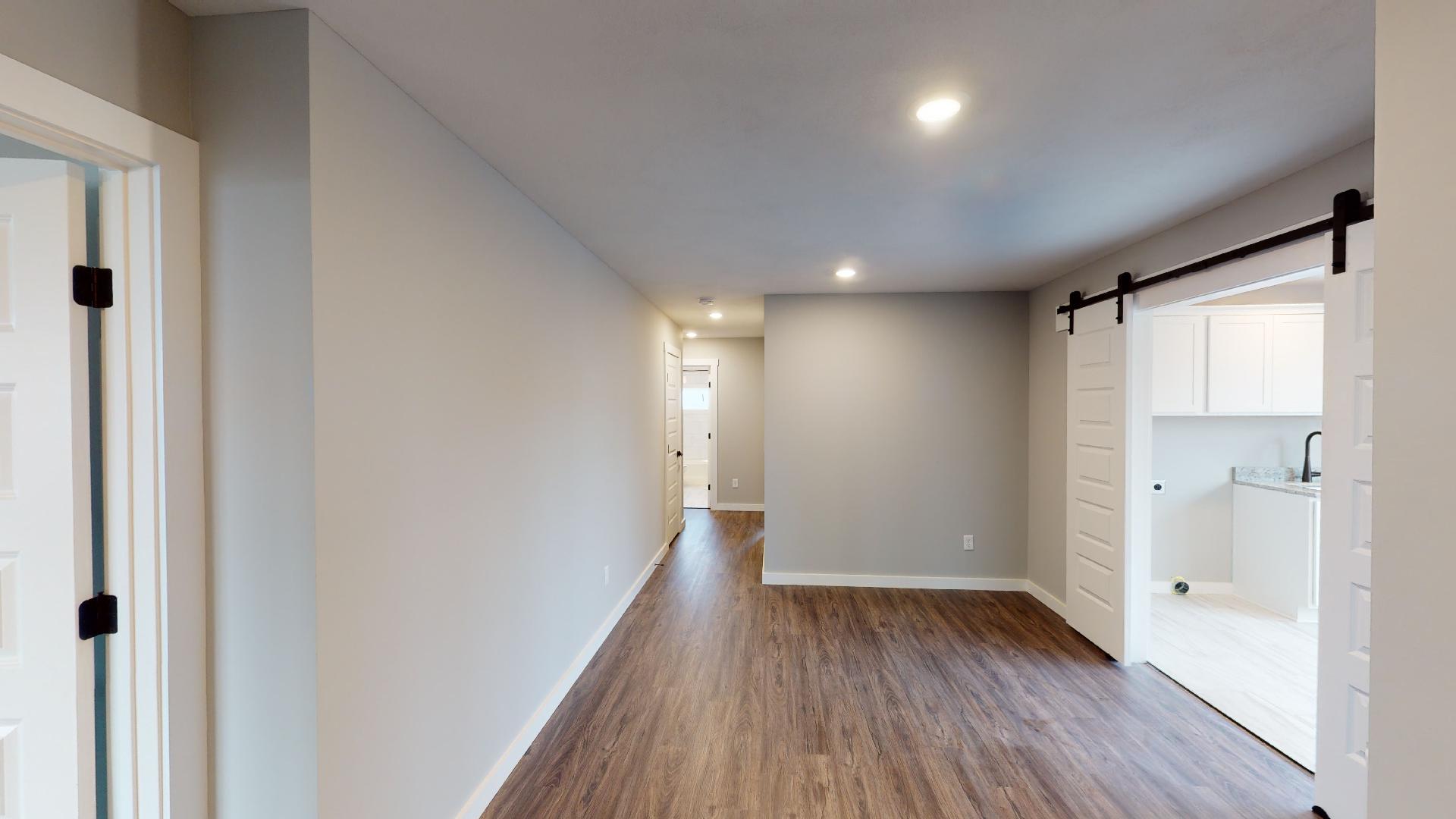 hallway and barn doors to laundry room