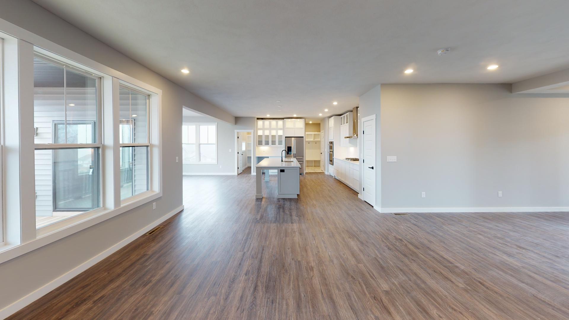 living room with kitchen in background