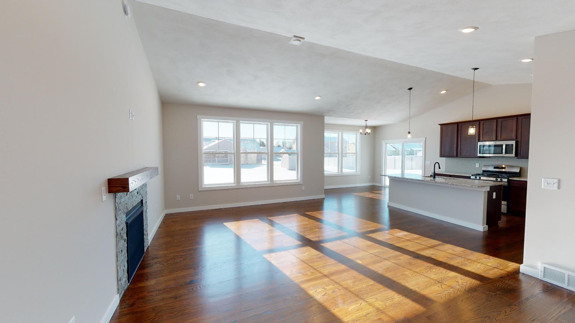 living room and kitchen with vaulted ceilings