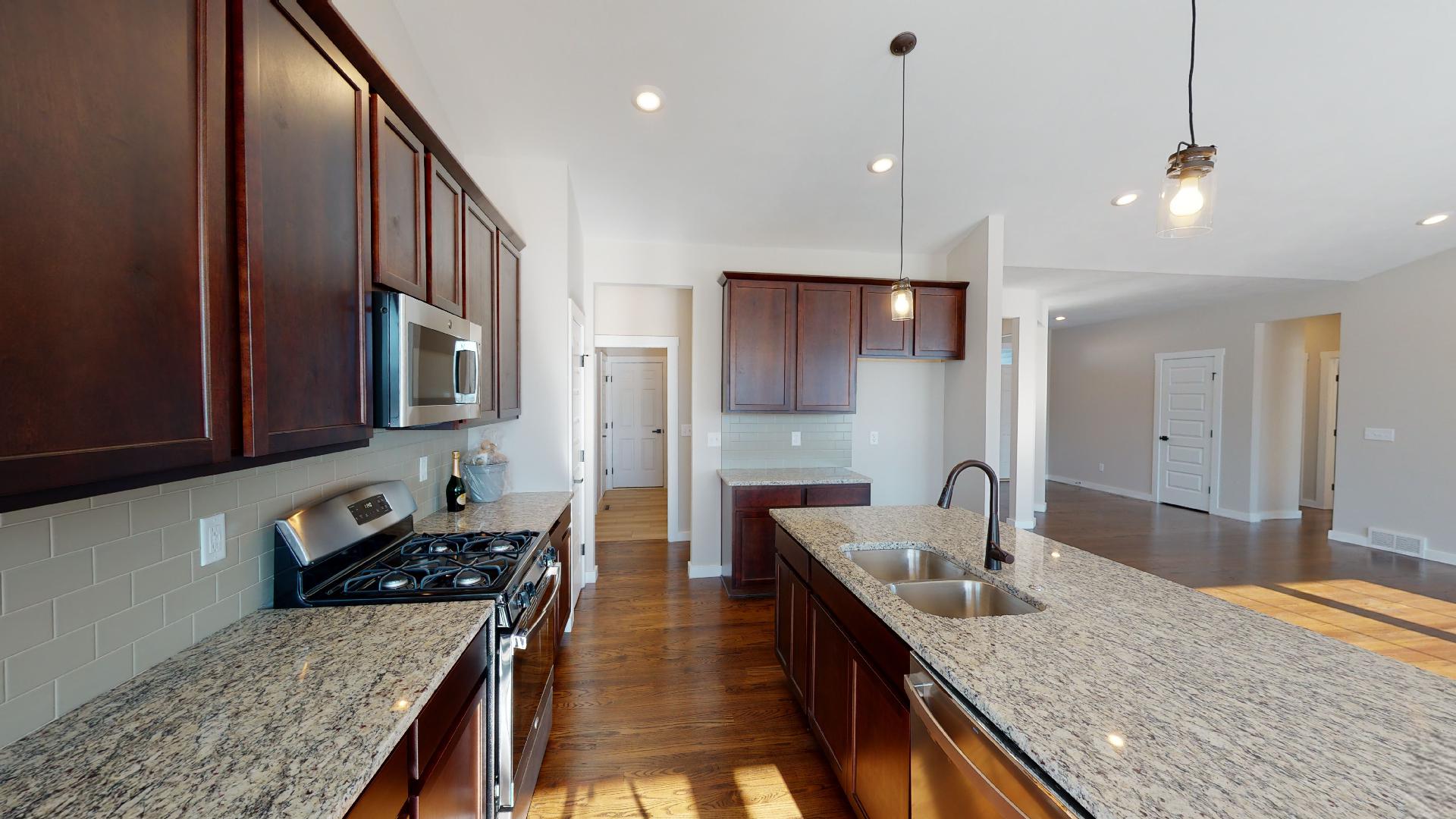 Kitchen and front entryway in background