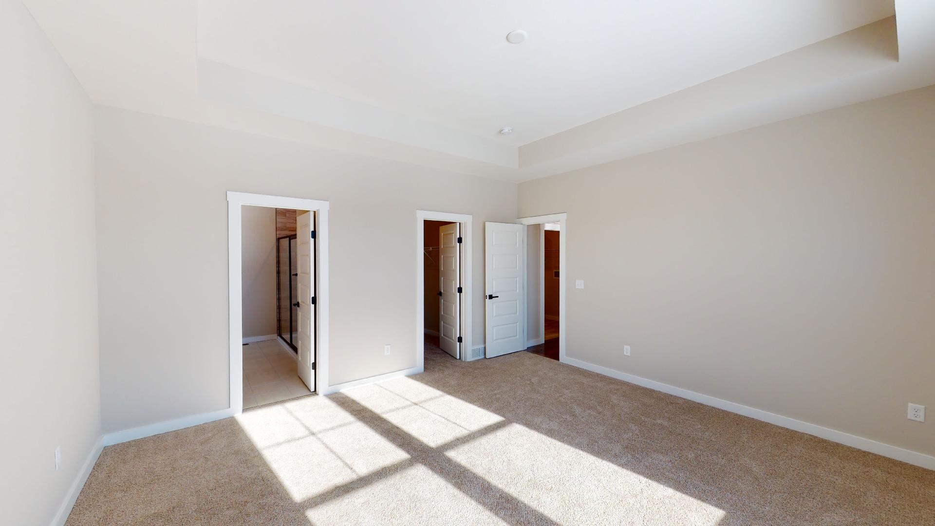 primary bedroom with ensuite bathroom