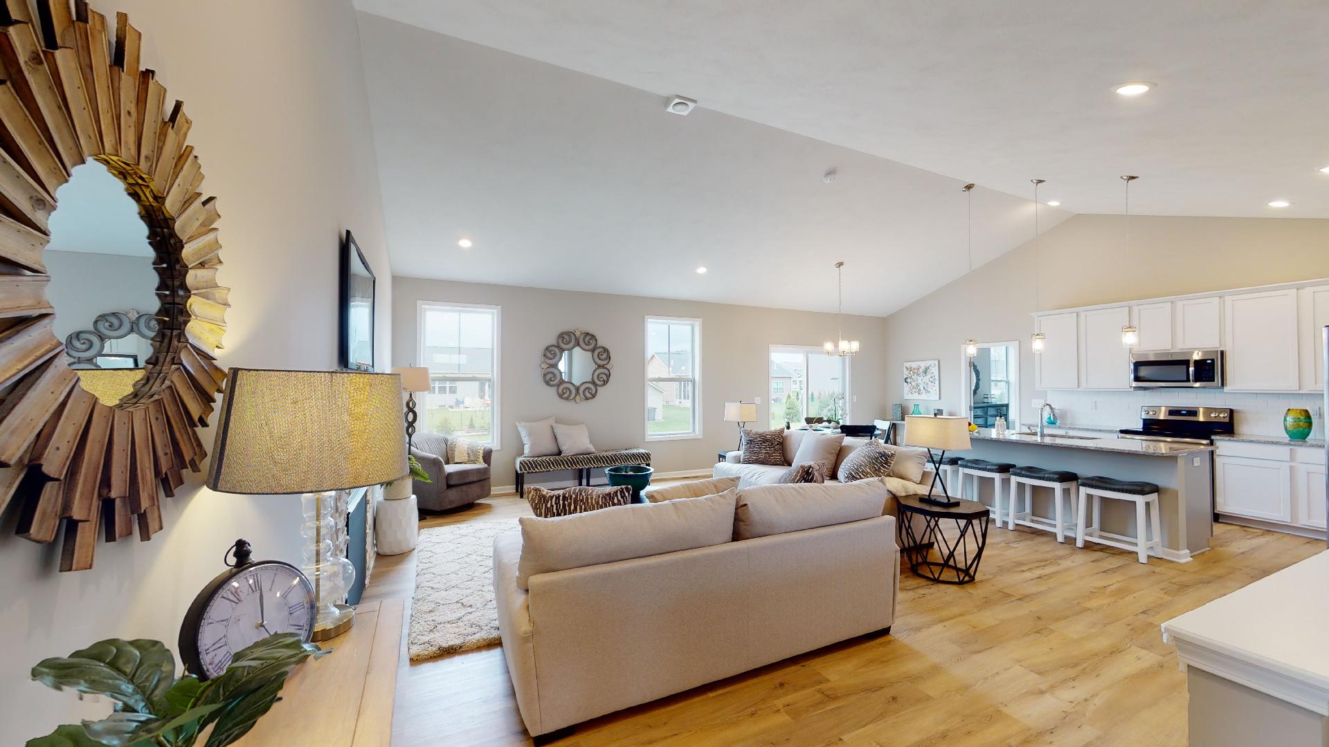 living room and kitchen with vaulted ceilings
