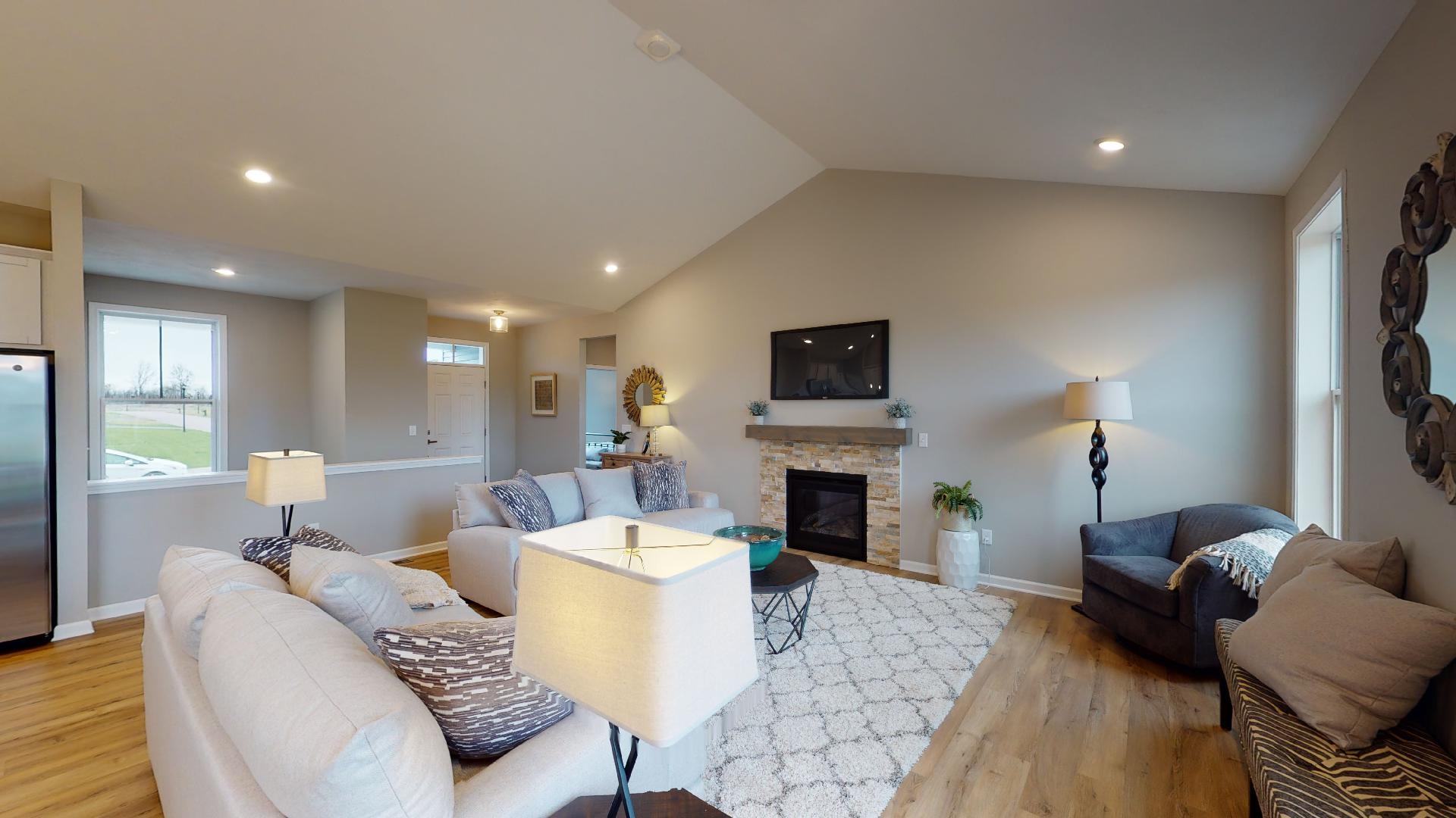 living room with front entryway in background