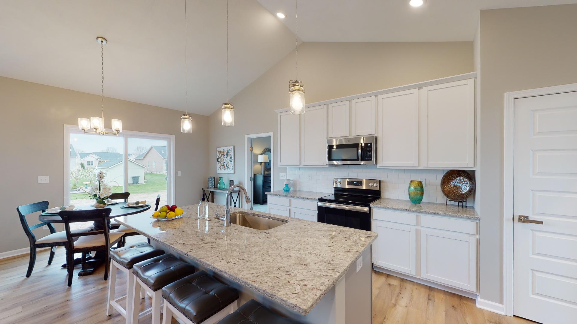 kitchen with island and vaulted ceiling