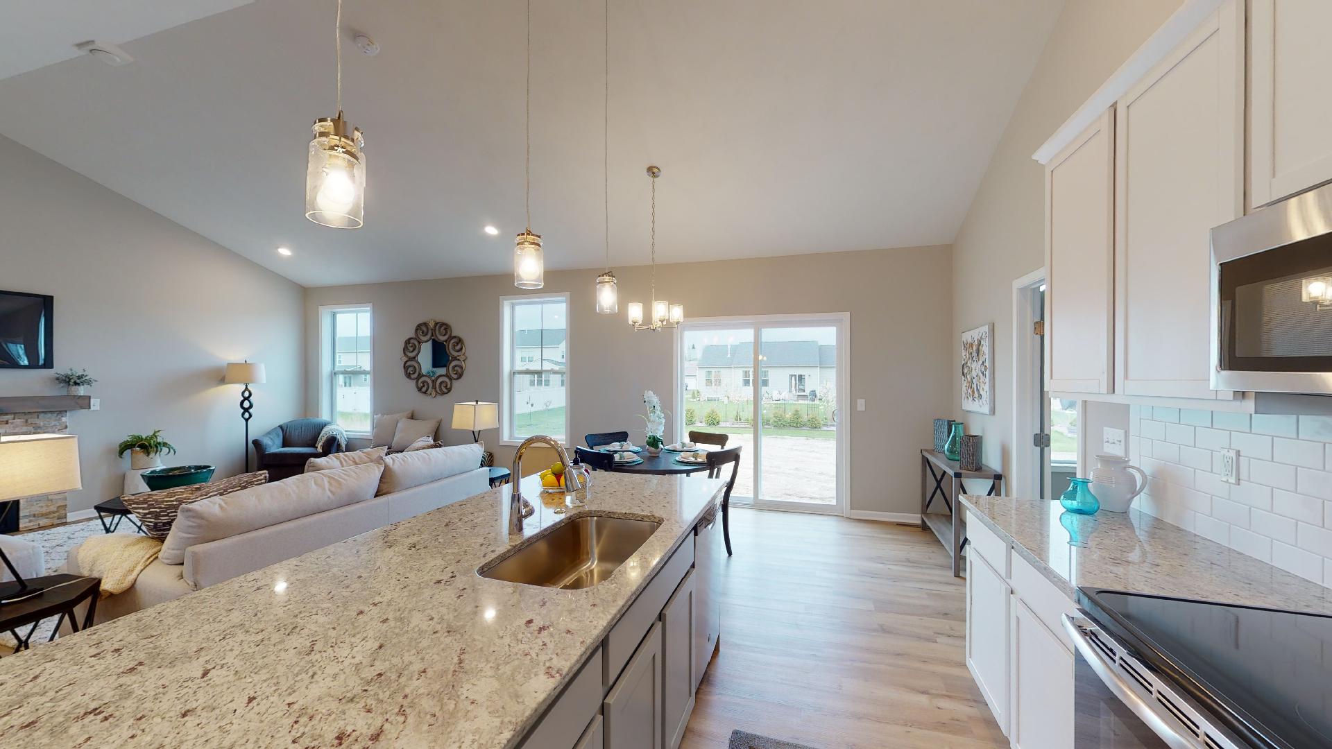 kitchen with dinette and living room in background