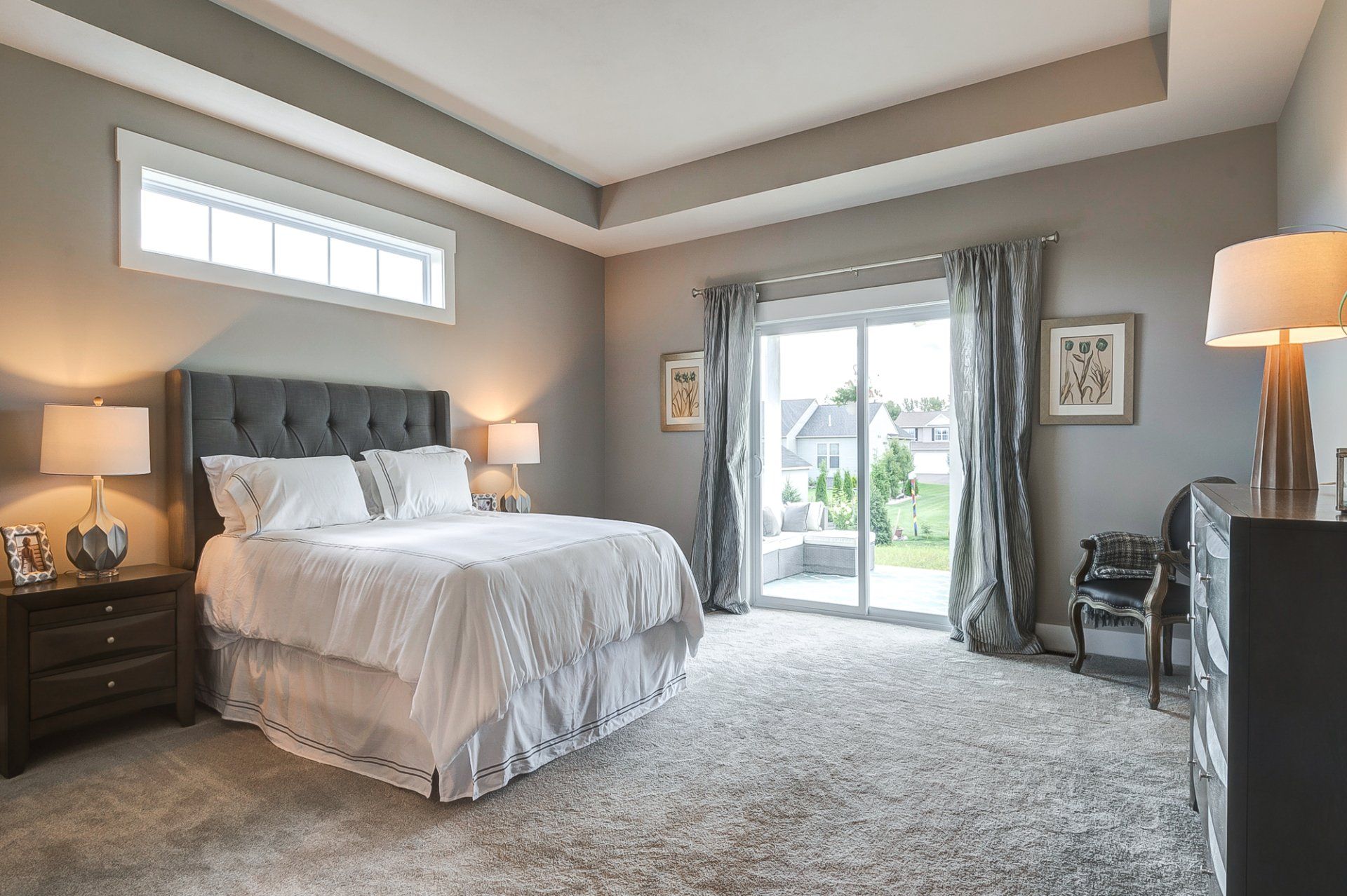 primary bedroom with recessed ceiling