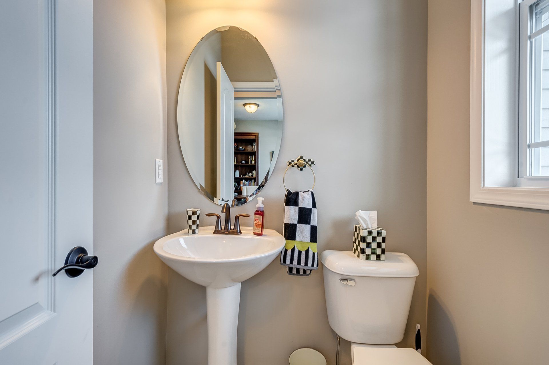 pedestal sink next to toilet
