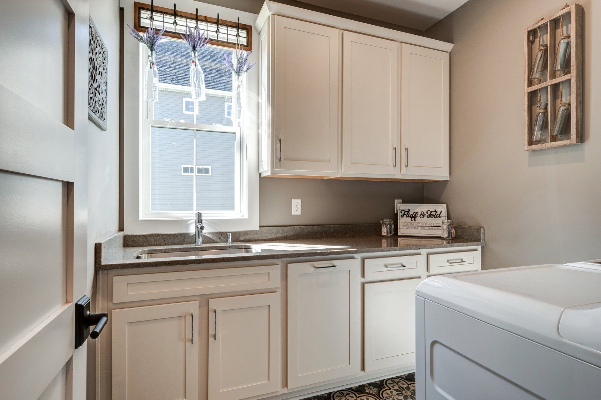 laundry room sink and cabinets