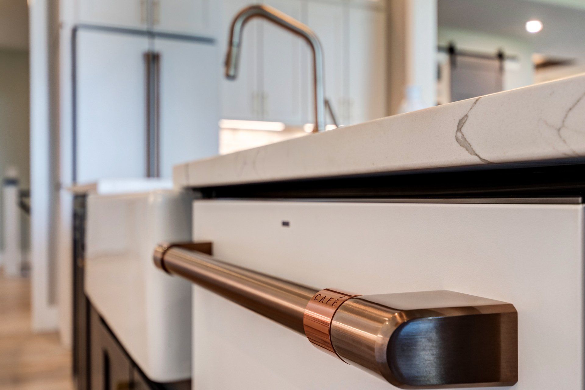 farmhouse sink and dishwasher under island