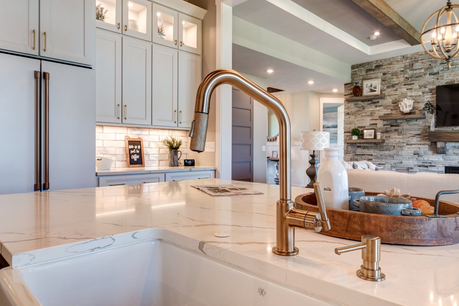 marble island and brass faucet