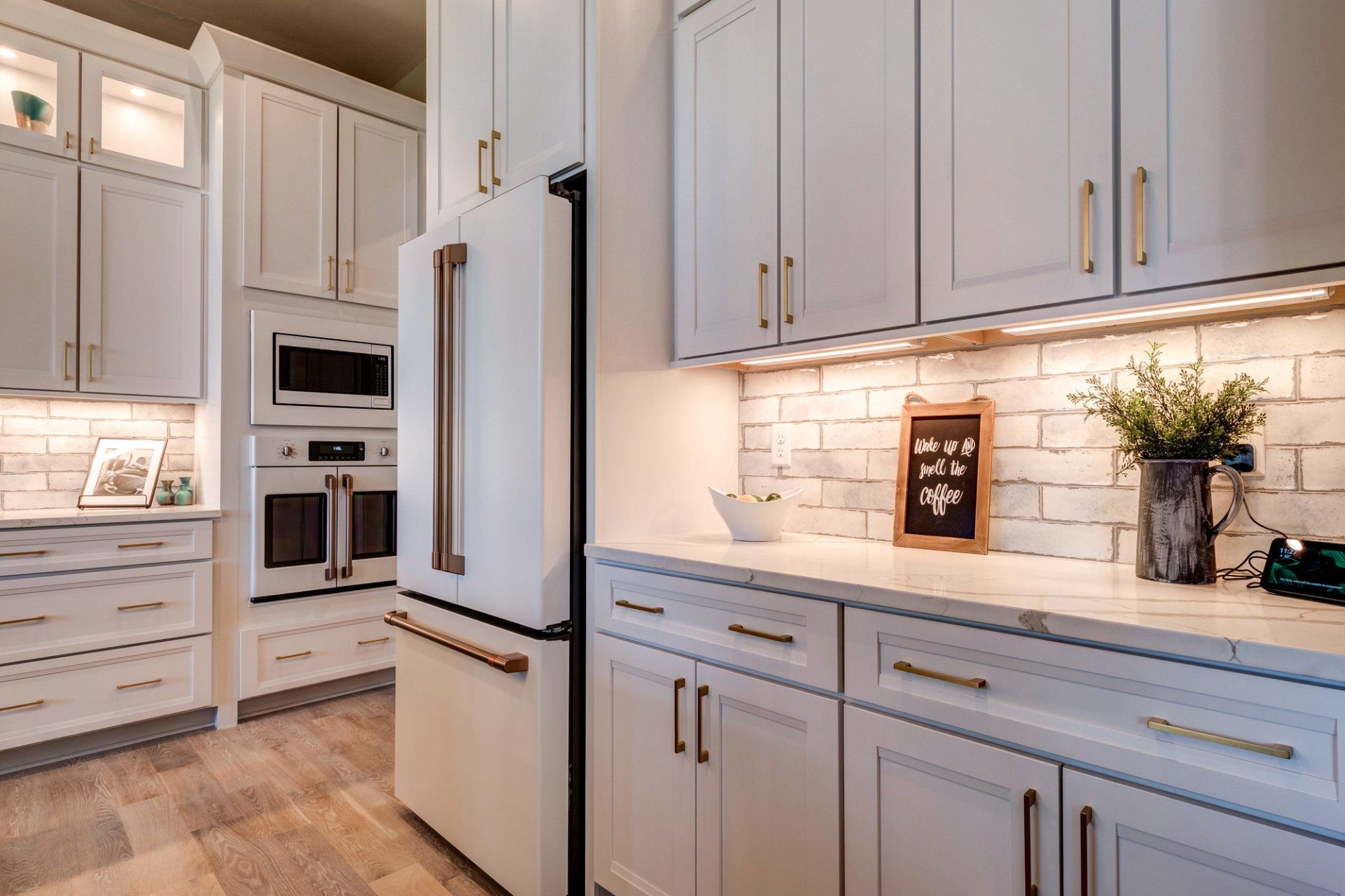 white appliances and under cabinet lighting