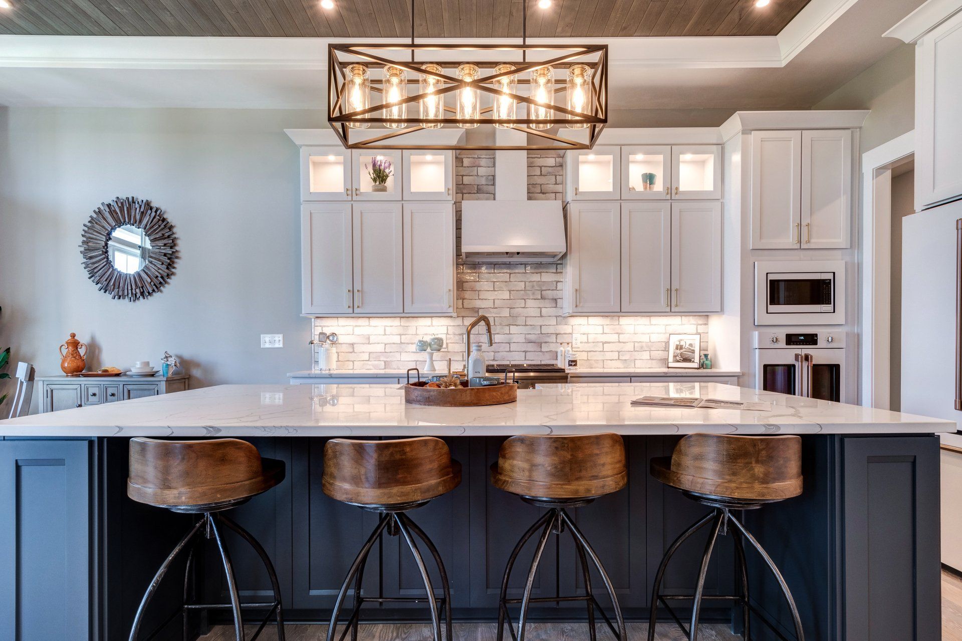 kitchen island with seating and light fixture above