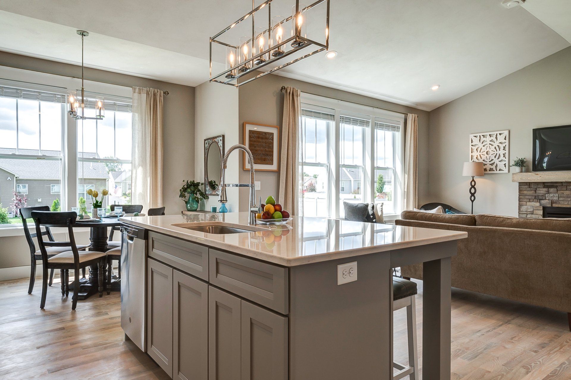 kitchen island with dinette and living room in background