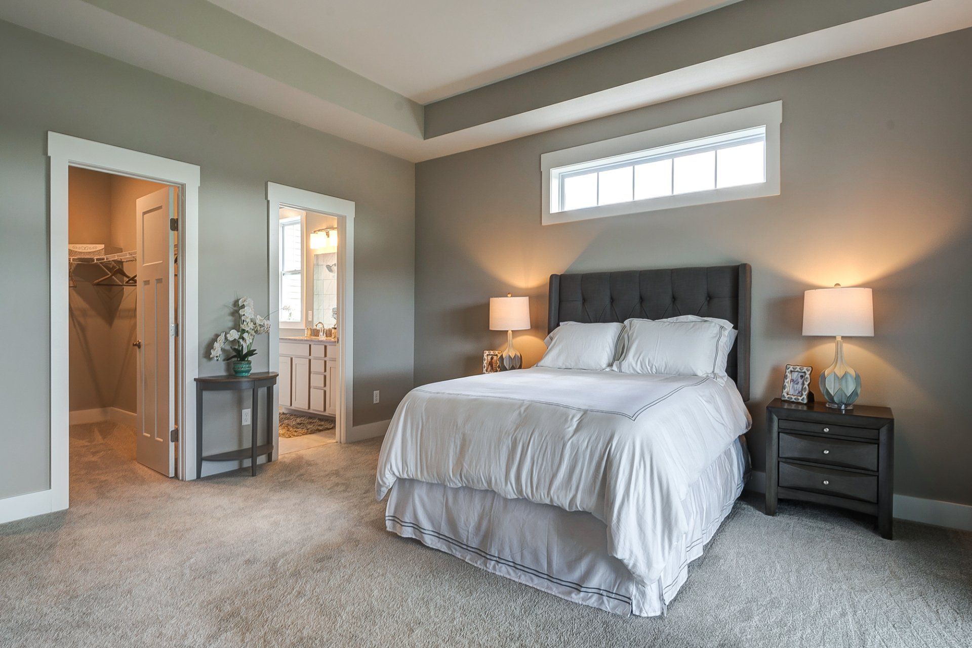 primary bedroom with ensuite bathroom and walk-in closet