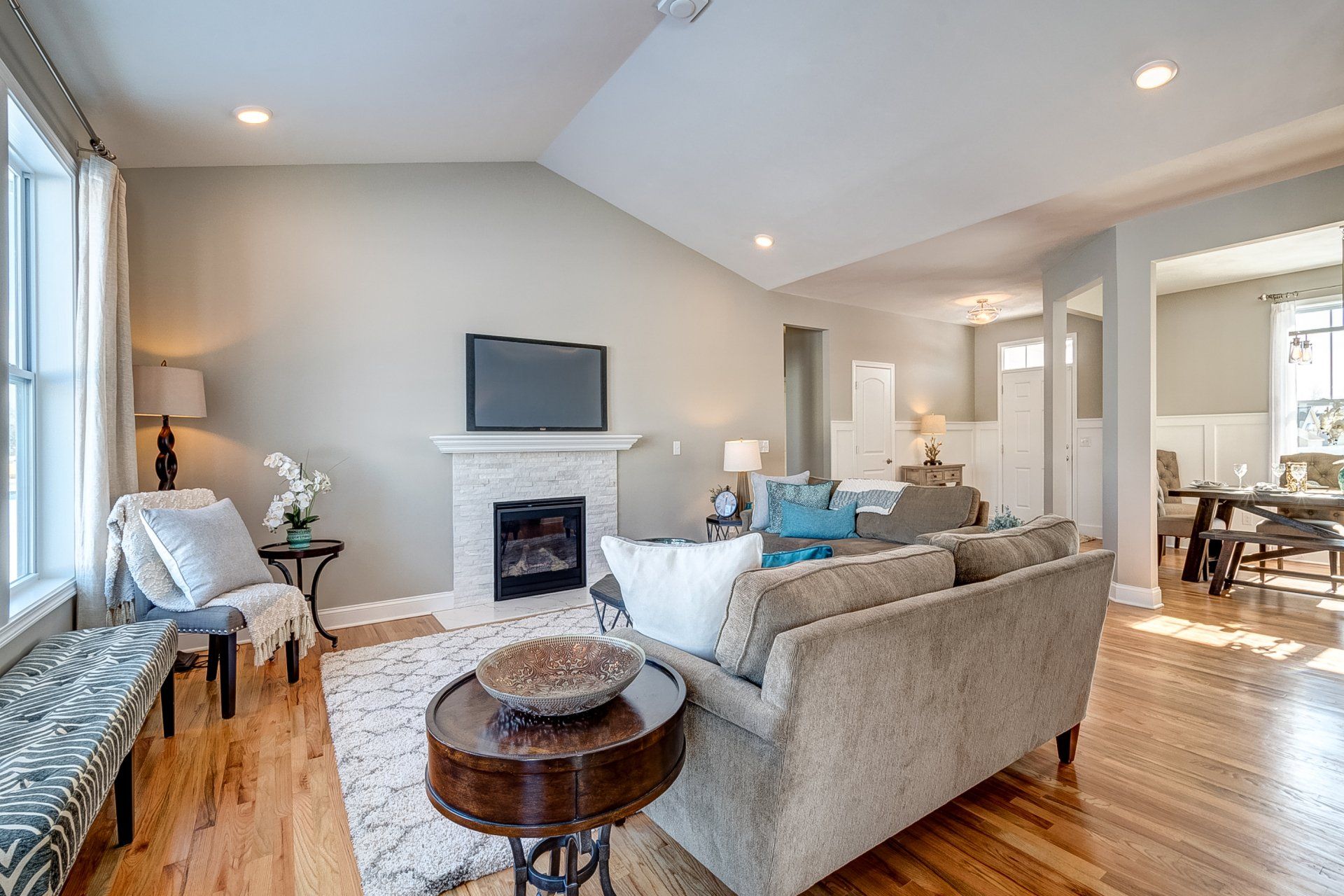 living room with fireplace and vaulted ceiling