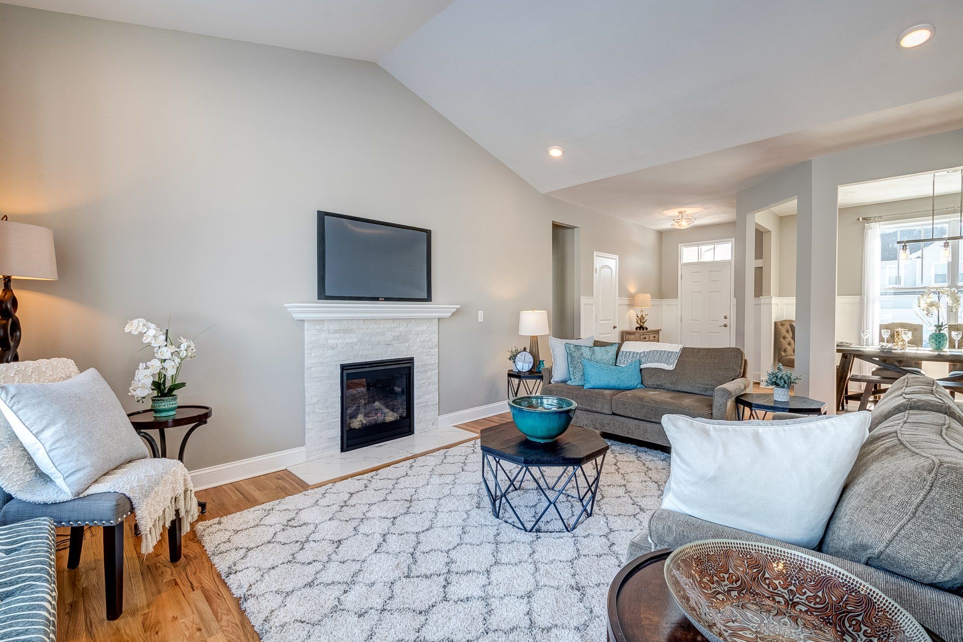 living room with fireplace and vaulted ceiling