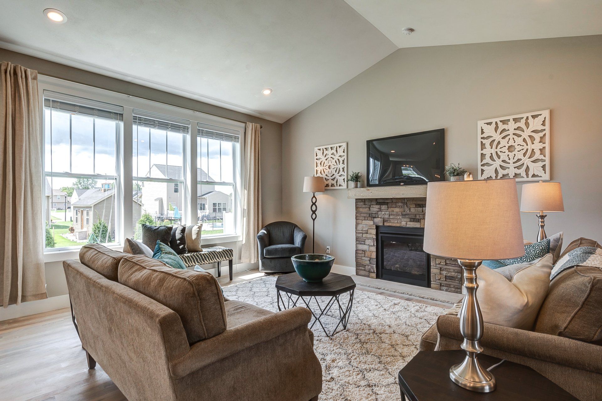 living room with fireplace and 3 windows