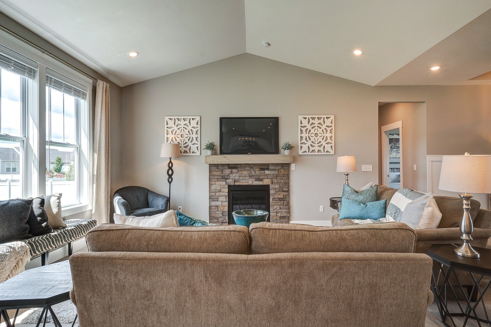living room with fireplace and vaulted ceiling